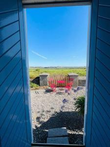 an open door of a house with a view of a patio at Preachers Rest in Killough