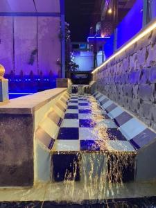 a water feature in a building with a fountain at مزرعة طلة الهيبة in Jal‘ad
