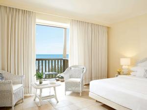 Posteľ alebo postele v izbe v ubytovaní Grecotel Marine Palace & Aqua Park