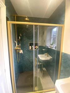 a bathroom with a shower and a sink at Luxury Georgian Townhouse - Central Liverpool Location (Falkner St) in Liverpool