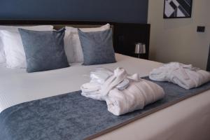 Giường trong phòng chung tại Hotel Vitruvio