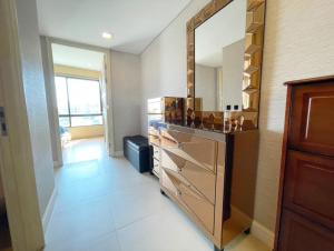 a bathroom with a large mirror and a dresser at Marrakesh Hua Hin condo 2 bedrooms with stunning sea view and pool view in Hua Hin