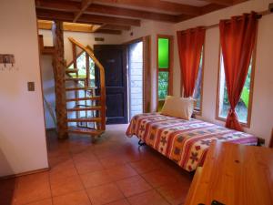 Postel nebo postele na pokoji v ubytování Cabañas Kalfucura