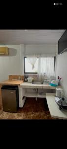Kuchyň nebo kuchyňský kout v ubytování Apartamento leidy