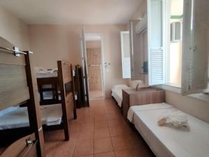 Casa das Luzes Hostel IVN客房内的一张或多张床位