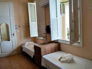 Casa das Luzes Hostel IVN客房内的一张或多张床位