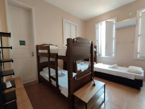 Casa das Luzes Hostel IVN客房内的一张或多张床位