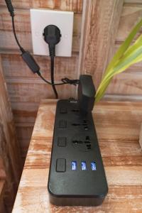 a remote control sitting on top of a table at Garden Terrace Bali in Gobleg