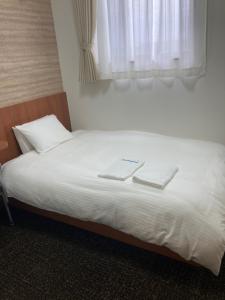 Katil atau katil-katil dalam bilik di Business hotel ARM Futaba