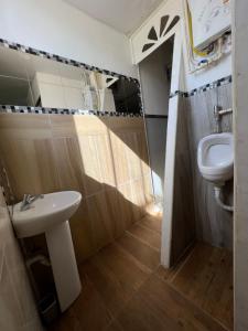 a bathroom with a sink and a toilet at Hostel Eco Punta Cana in Punta Cana +39 photos