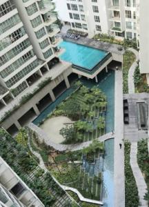 an aerial view of a building with a swimming pool at Regalia Suites KLCC View Rooftop Infinity Pool by SHI in Kuala Lumpur