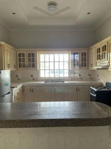 a kitchen with a sink and a counter top at Tu casa en Macaracas! in Llano de Piedra