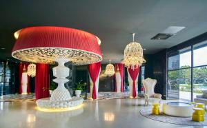 a room with a large red lamp on a table at Arte Mont Kiara Free Parking, Kuala Lumpur in Kuala Lumpur +63 photos