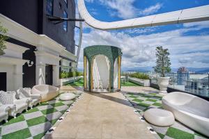 a balcony with two tubs on a building at Arte Mont Kiara Free Parking, Kuala Lumpur in Kuala Lumpur