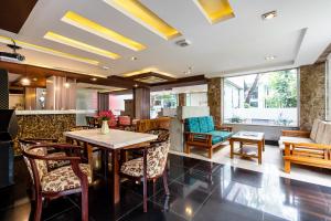 a dining room with a table and chairs at La Palma Boutique Hotel in Ho Chi Minh City