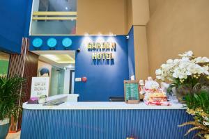 a blue wall with a sign that reads orphan animal hospital at La Palma Boutique Hotel in Ho Chi Minh City