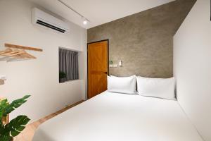 Letto o letti in una camera di Donggang Jingdi B&B