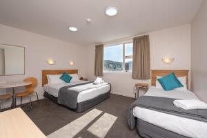 Postel nebo postele na pokoji v ubytování Capital View Motor Inn - Free Parking