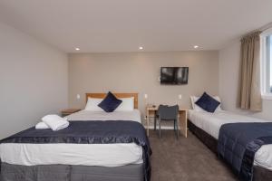 Voodi või voodid majutusasutuse Capital View Motor Inn - Free Parking toas