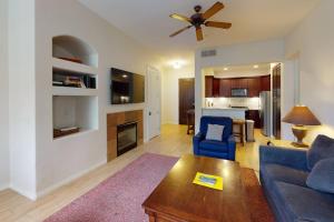 a living room with a couch and a table at LV101 Downstairs 1 Bedroom Legacy Villas Retreat in La Quinta +11 photos
