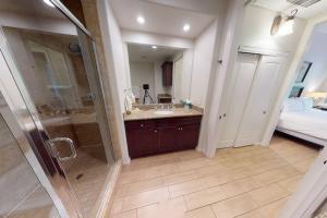 a bathroom with a shower and a sink at LV101 Downstairs 1 Bedroom Legacy Villas Retreat in La Quinta
