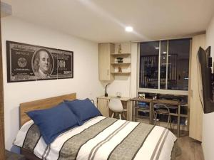 Ένα ή περισσότερα κρεβάτια σε δωμάτιο στο Torre Ventto Lofts 24/7