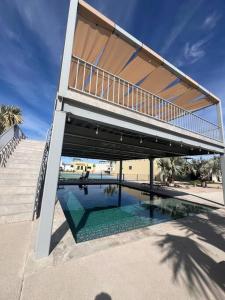 a building with a swimming pool with a bridge at Casa Portobello in La Paz