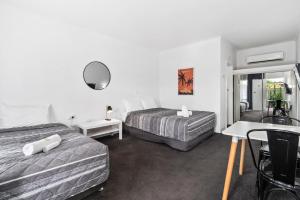 Comfort Inn Commodore Albury客房内的一张或多张床位