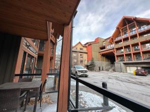 a view of a street from a balcony of a building at Solara Mountain Retreat - Pool - Hot Tub - Spa - Gym in Canmore