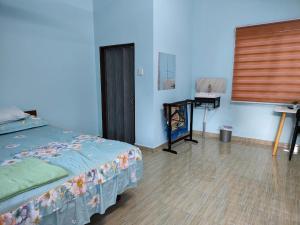Ένα ή περισσότερα κρεβάτια σε δωμάτιο στο Homestay Teratak D`kemangi with Private Pool
