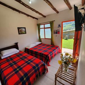 Postel nebo postele na pokoji v ubytování Posada Turistica Nakku