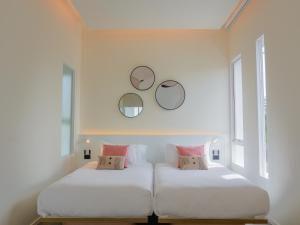 Postel nebo postele na pokoji v ubytování Veranda Pool Villas & Suite