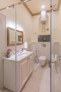 a bathroom with a sink and a toilet at Laalee in Jaipur