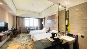TV a/nebo společenská místnost v ubytování Ramada Foshan Hotel