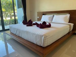 Кровать или кровати в номере Dusit Long Beach +20 фотографий