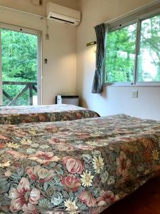 Voodi või voodid majutusasutuse Garden Villa Minamiaso toas
