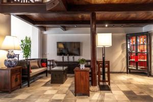 a living room with a couch and a table at Punyashthiti villa in Chanthaburi