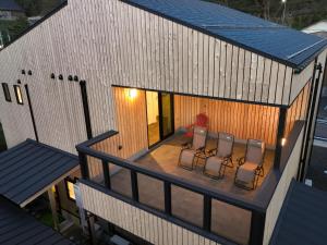 an overhead view of a house with chairs on a deck at Sumiyoshiya in Nagaoka