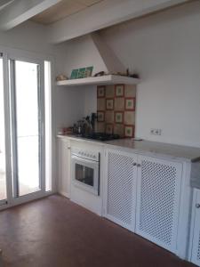 Kuchyň nebo kuchyňský kout v ubytování Preciosa casa en primera línea del mar