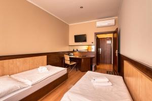 Postel nebo postele na pokoji v ubytování Congress Hotel Centrum