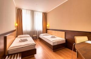 Postel nebo postele na pokoji v ubytování Congress Hotel Centrum
