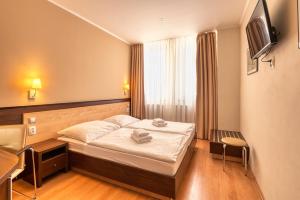 Postel nebo postele na pokoji v ubytování Congress Hotel Centrum