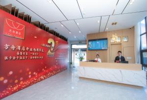 a reception area of a hospital with a red wall at ARK HOTEL in Phnom Penh