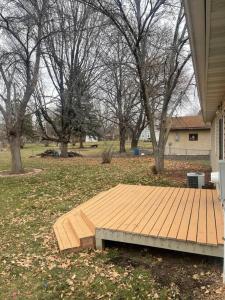 a wooden deck on the side of a house at Miracle House in Brooklyn Park
