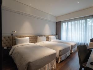 Rúm í herbergi á Hotel Mvsa+Michelin 2 Starred Molino de Urdàniz