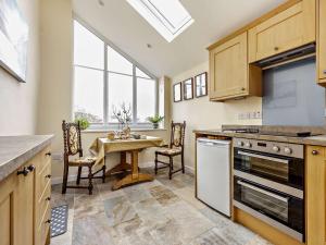 a kitchen with a table and chairs and a window at 1 Bed in Matterdale 91812 in Dockray