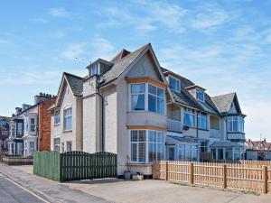 a large house with a fence in front of it at 2 Bed in Hornsea 91997 in Hornsea