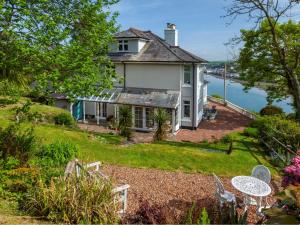 an image of a house with a view of the water at 5 Bed in Westward Ho 91772 in Bideford