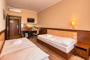 Postel nebo postele na pokoji v ubytování Congress Hotel Centrum