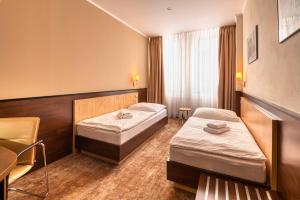 Postel nebo postele na pokoji v ubytování Congress Hotel Centrum